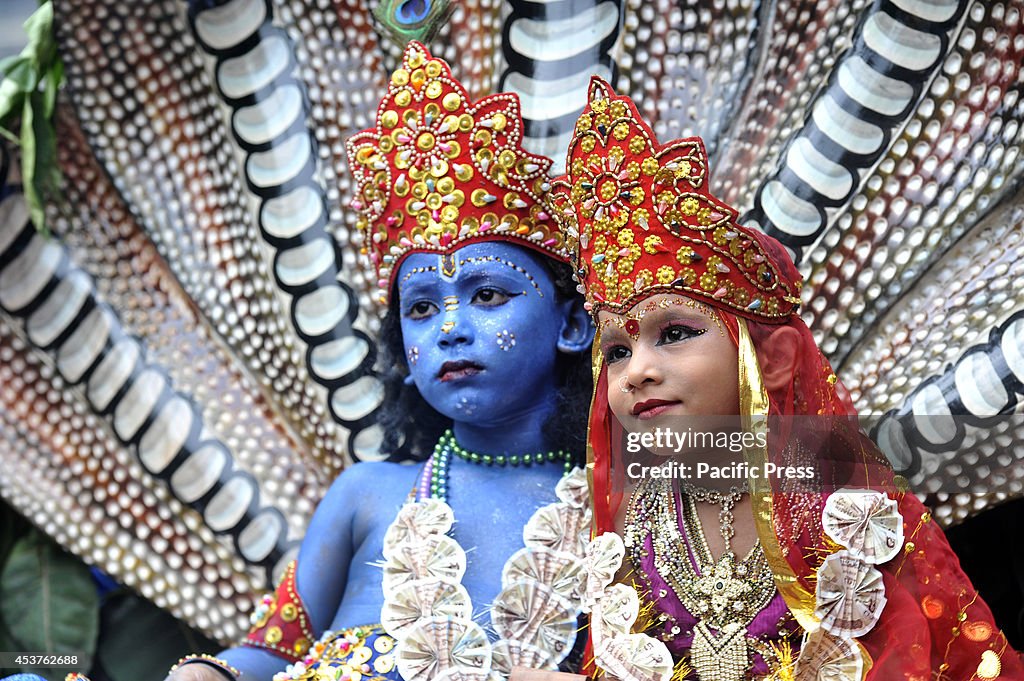 The little children dressed like Radha and Krishna during...