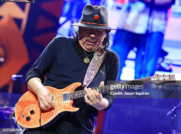 Musician Carlos Santana performs at Sprint Center on August 14, 2014 in Kansas City, Missouri.