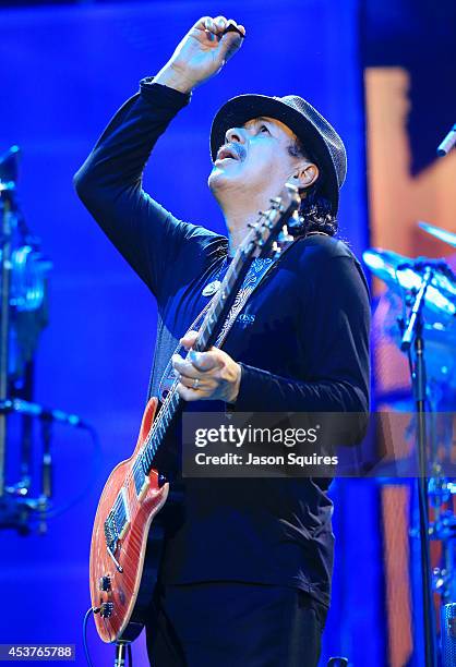 Musician Carlos Santana performs at Sprint Center on August 14, 2014 in Kansas City, Missouri.