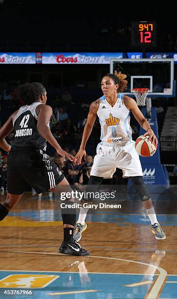 Courtney Clements of the Chicago Sky handles the ball against Shenise Johnson of the San Antonio Stars on August 17, 2014 at the Allstate Arena in...