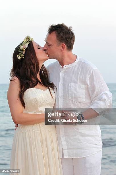 Holger Stromberg and his wife Nikita pose during their wedding on August 9, 2014 in Ibiza, Spain.