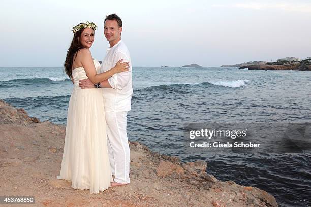 Holger Stromberg and his wife Nikita pose during their wedding on August 9, 2014 in Ibiza, Spain.