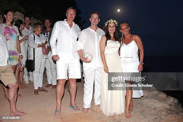 Best man Marc-Oliver Stromberg, groom Holger Stromberg, maid of honor Patricia Ay and bride Nikita Stromberg pose during the wedding of star chef...