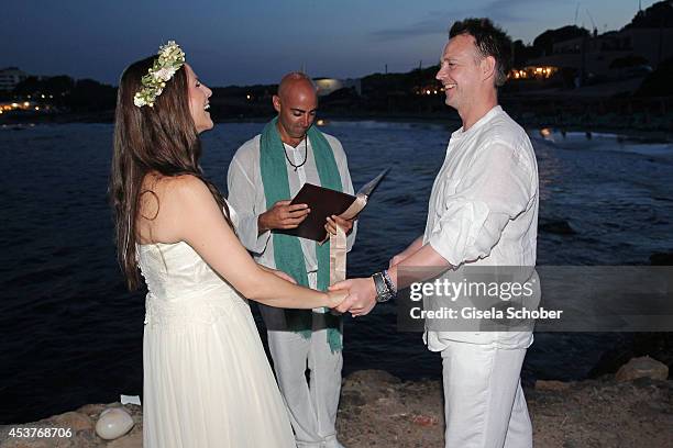 Holger Stromberg , his wife Nikita and Melchior during the ceremony of their wedding on August 9, 2014 in Ibiza, Spain.