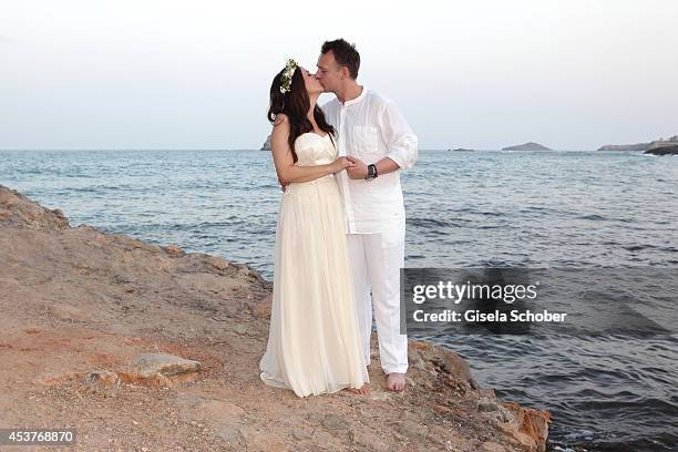 Holger Stromberg and his wife Nikita pose during their wedding on August 9, 2014 in Ibiza, Spain.