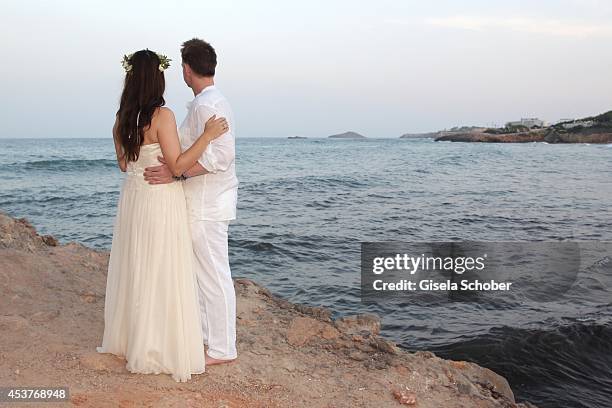 Holger Stromberg and his wife Nikita pose during their wedding on August 9, 2014 in Ibiza, Spain.