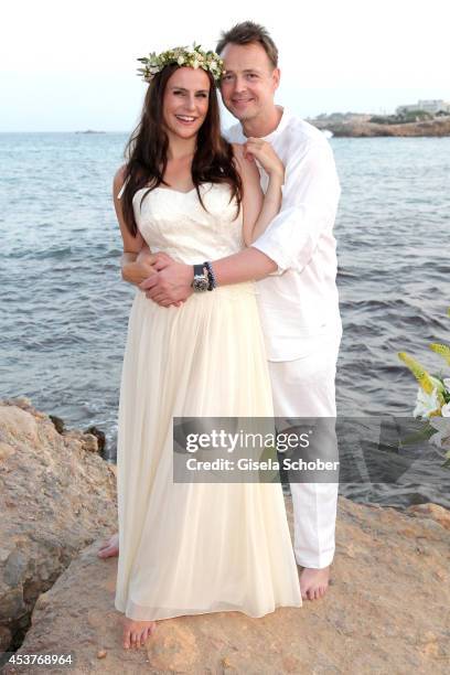 Holger Stromberg and his wife Nikita pose during their wedding on August 9, 2014 in Ibiza, Spain.