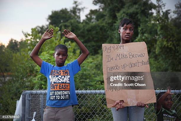 Leo Walker and his sister Letrece protest the killing of teenager Michael Brown on August 17, 2014 in Ferguson, Missouri. Despite the Brown family's...
