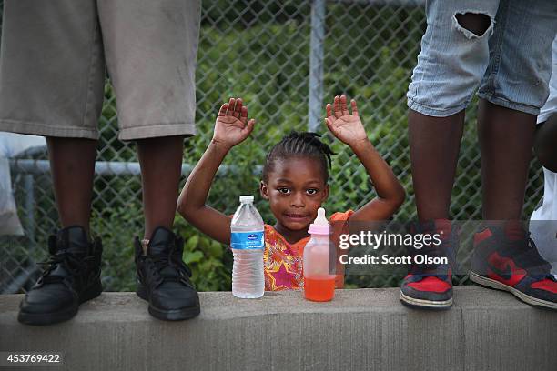 Gabrielle Walker protests the killing of teenager Michael Brown on August 17, 2014 in Ferguson, Missouri. Despite the Brown family's continued call...