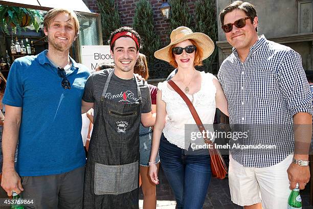 Actors Aaron Staton, Ben Feldman, Christina Hendricks, and Rich Sommer attend Crab Cake 2014 presented by S. Pellegrino & Samsung Galaxy on August...