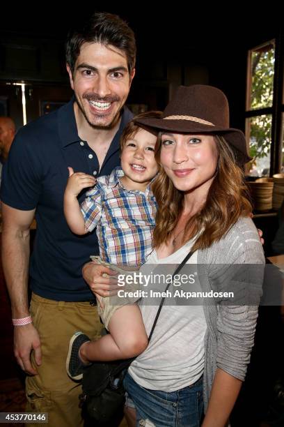 Actor Brandon Routh and actress Courtney Ford with their son, Leo James Routh, attend Crab Cake 2014 presented by S. Pellegrino & Samsung Galaxy on...