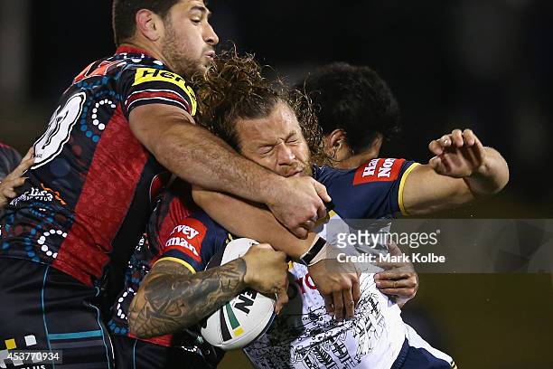 Ashton Sims of the Cowboys is tackled during the round 23 NRL match between the Penrith Panthers and the North Queensland Cowboys at Sportingbet...