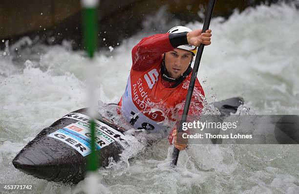 Alexander Grimm of Germany competes a qualifacation heat at the Kayak Men on August 15, 2014 in Augsburg, Germany.