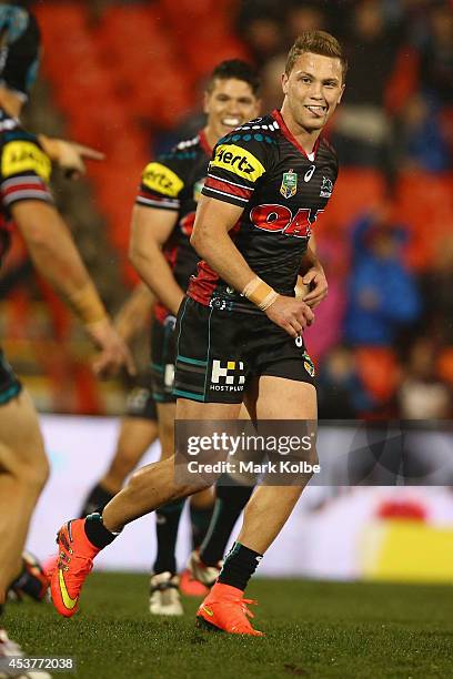 Matt Moylan of the Panthers celebrates kicking a field goal to take the Panthers ahead 23-22 during the round 23 NRL match between the Penrith...