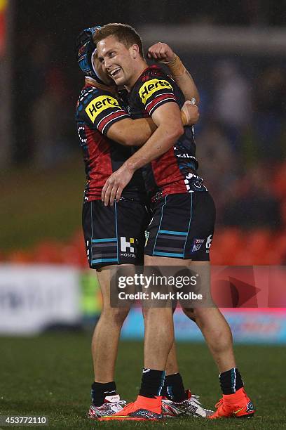 Jamie Soward and Matt Moylan of the Panthers celebrate the Panthers 23-22 victory during the round 23 NRL match between the Penrith Panthers and the...