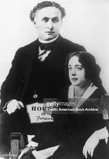 Hungarian-American escapologist Harry Houdini with his wife and stage assistant, Bess , circa 1922.