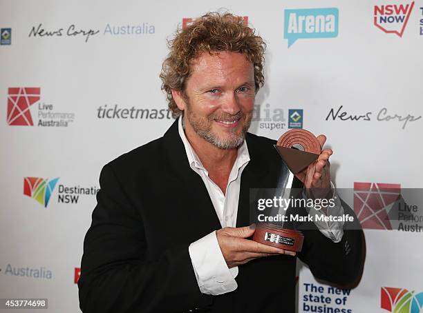 Craig McLachlan poses with the award for Best Actor in a Musical at the Capitol Theatre on August 18, 2014 in Sydney, Australia.