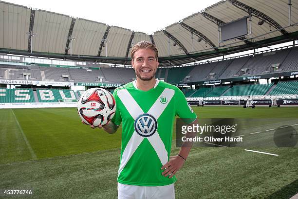 New Player Nicklas Bendtner of VfL Wolfsburg poses during a portrait session at Volkswagen Arena on August 15, 2014 in Wolfsburg, Germany.