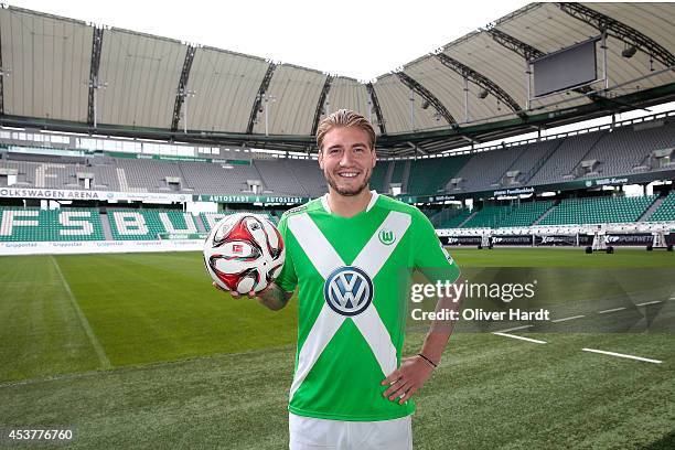 New Player Nicklas Bendtner of VfL Wolfsburg poses during a portrait session at Volkswagen Arena on August 15, 2014 in Wolfsburg, Germany.