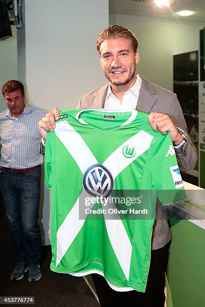 New Player Nicklas Bendtner of VfL Wolfsburg poses during a press conference at Volkswagen Arena on August 15, 2014 in Wolfsburg, Germany.