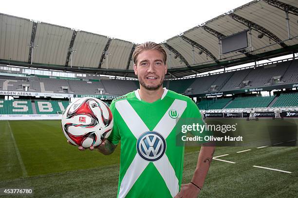 New Player Nicklas Bendtner of VfL Wolfsburg poses during a portrait session at Volkswagen Arena on August 15, 2014 in Wolfsburg, Germany.