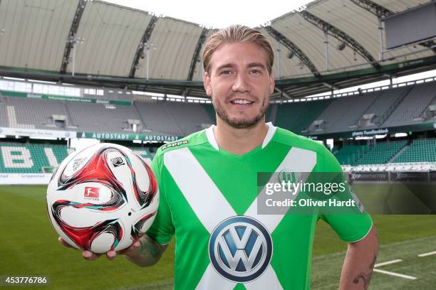 New Player Nicklas Bendtner of VfL Wolfsburg poses during a portrait session at Volkswagen Arena on August 15, 2014 in Wolfsburg, Germany.