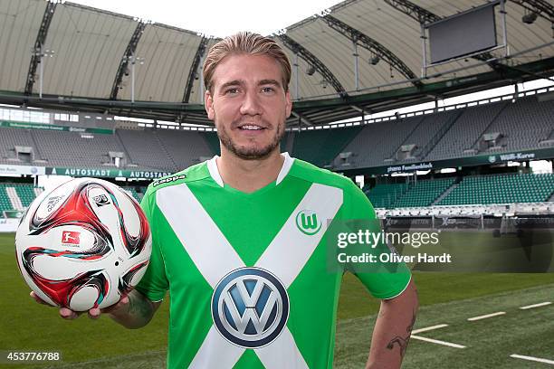 New Player Nicklas Bendtner of VfL Wolfsburg poses during a portrait session at Volkswagen Arena on August 15, 2014 in Wolfsburg, Germany.