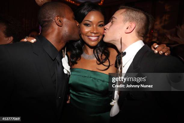 Actress Gabrielle Union poses with Alvin Ailey's Samuel Lee Roberts and Michael Francis McBride during the 2013 Alvin Ailey American Dance Theater's...