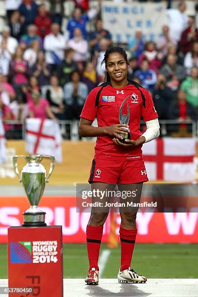 Magali Harvey of Canada receives the runners-up trophy during the IRB Women's Rugby World Cup 2014 Final between England and Canada at Stade...