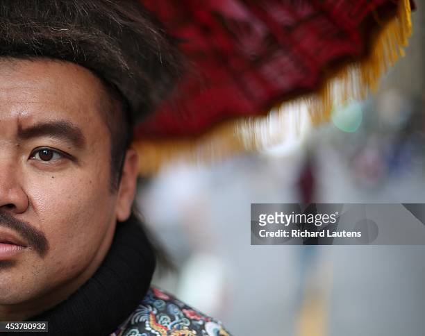 Toronto, Canada - August 17 - Wayne Sujo is dressed as Qing Dynasty Emperor Yongjeng to promote the ROM on Bloor street near Bay. Open Streets...