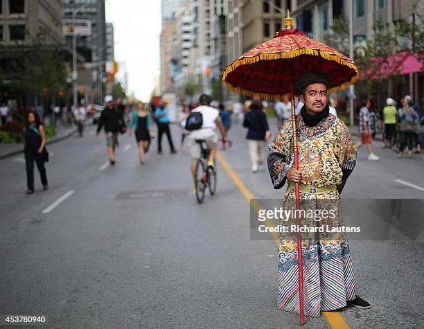 Toronto, Canada - August 17 - Wayne Sujo is dressed as Qing Dynasty Emperor Yongjeng to promote the ROM on Bloor street near Bay. Open Streets...