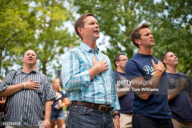 Reps. Rodney Davis, R-Ill., center, and Aaron Schock, R-Ill., recite the Pledge of Allegiance during Republican Day at the Illinois State Fair in...