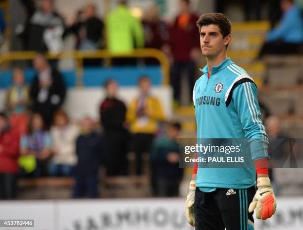 Chelsea's Belgian goalkeeper Thibaut Courtois warms-up ahead of the English Premier League football match between Burnley and Chelsea at Turf Moor in...