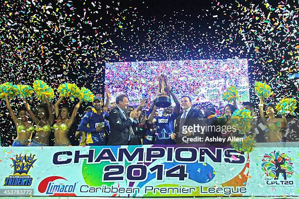 Kieron Pollard lifts the trophy after the Limacol Caribbean Premier League 2014 final match between Guyana Amazon Warriors and Barbados Tridents at...