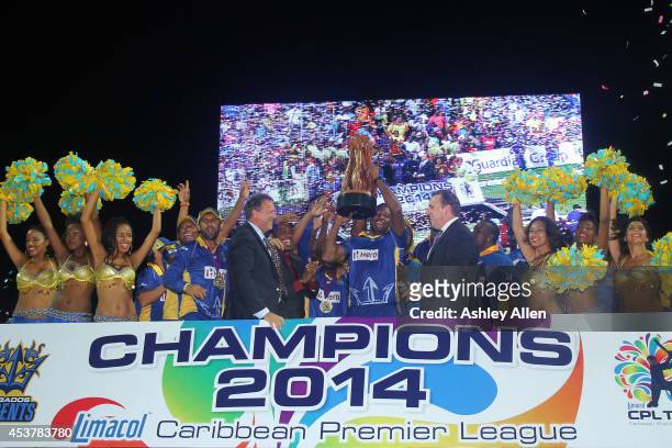 Kieron Pollard and the Barbados Tridents celebrate after the Limacol Caribbean Premier League 2014 final match between Guyana Amazon Warriors and...