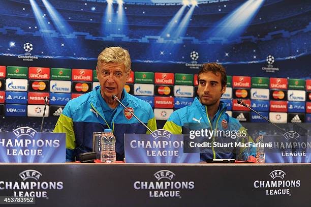 Arsenal manager Arsene Wenger and midfielder Mathieu Flamini attend a press conference at the Ataturk Olympic Stadium on August 18, 2014 in Istanbul,...