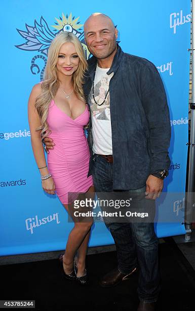 Actress Mindy Robinson and actor/fighter Randy Couture arrive for The Geekie Awards 2014 held at Avalon on August 17, 2014 in Hollywood, California.