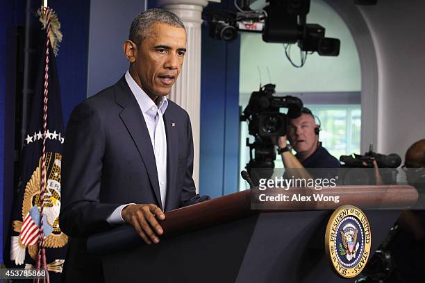 President Barack Obama makes a statement in the James Brady Press Briefing Room of the White House August 18, 2014 in Washington, DC. Obama returned...