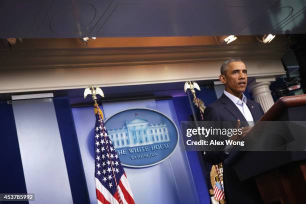 President Barack Obama makes a statement in the James Brady Press Briefing Room of the White House August 18, 2014 in Washington, DC. Obama returned...