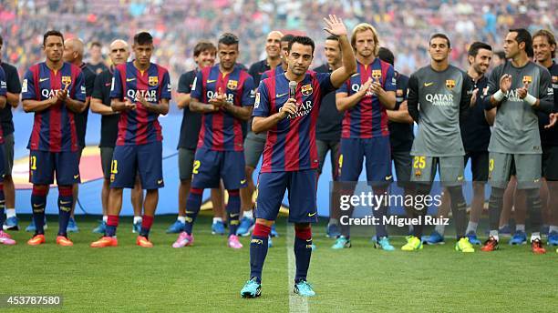Xavi Hernandez of FC Barcelona, gives a speech to the supporters before the Joan Gamper Trophy match between FC Barcelona and Leon CF at Camp Nou on...