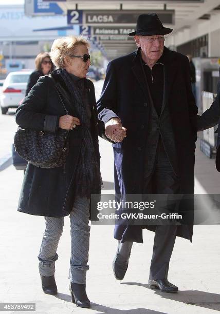 Max Von Sydow and his wife Catherine Brelet is seen at Los Angeles International Airport on February 29, 2012 in Los Angeles, California.