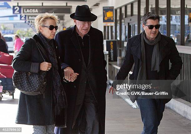 Max Von Sydow and his wife Catherine Brelet is seen at Los Angeles International Airport on February 29, 2012 in Los Angeles, California.