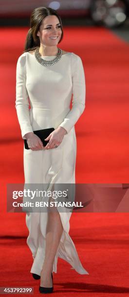 Britain's Catherine, Duchess of Cambridge, arrives with Prince William, Duke of Cambridge , to attend the royal film premier of "Mandela: Long Walk...