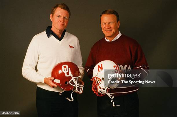 Barry Switzer of the Oklahoma Sooners and Tom Osborn of the Nebraska Cornhuskers pose for a photo on January 1, 1999.