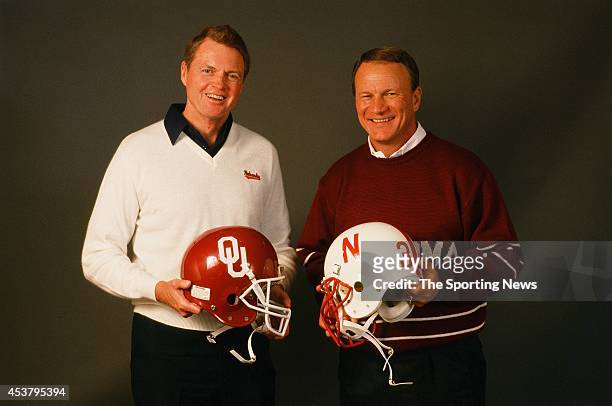 Barry Switzer of the Oklahoma Sooners and Tom Osborn of the Nebraska Cornhuskers pose for a photo on January 1, 1999.