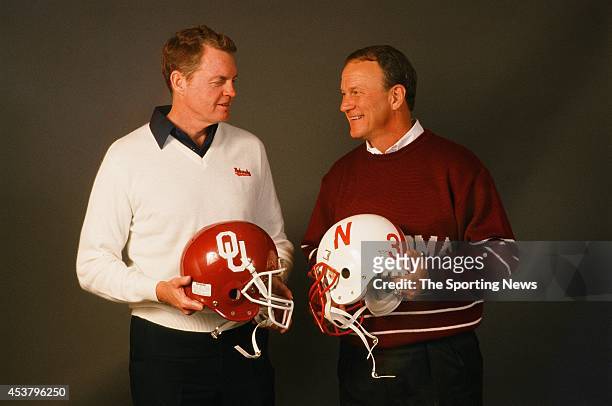 Barry Switzer of the Oklahoma Sooners and Tom Osborn of the Nebraska Cornhuskers pose for a photo on January 1, 1999.