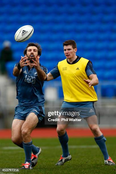 Conrad Smith of the All Blacks and Colin Slade during a New Zealand All Blacks training session at Trusts Stadium on August 19, 2014 in Auckland, New...