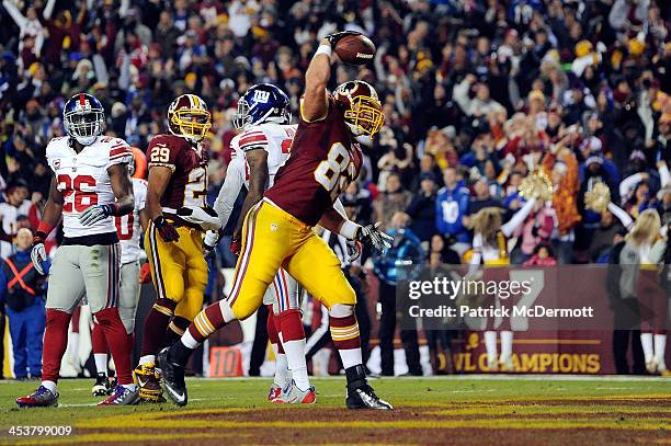 Logan Paulsen of the Washington Redskins celebrates after scoring a touchdown in the second quarter of an NFL game against the New York Giants at...