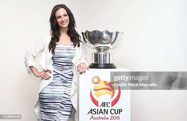 Lucy Zelic poses with the Asian Cup Trophy during the AFC Asian Cup Media Ambassador Announcement at Museum of Contemporary Art on August 19, 2014 in...