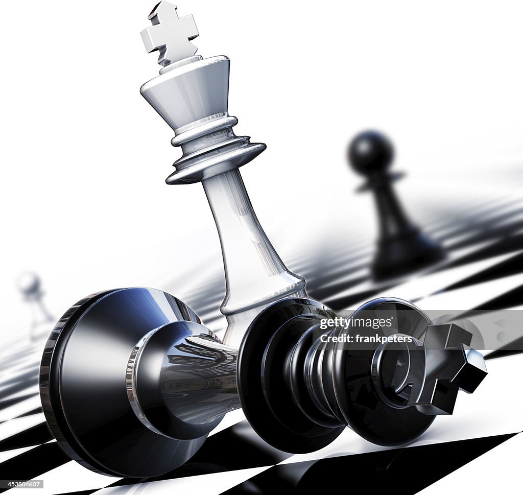 A black chess piece on its side on a checkered chess board